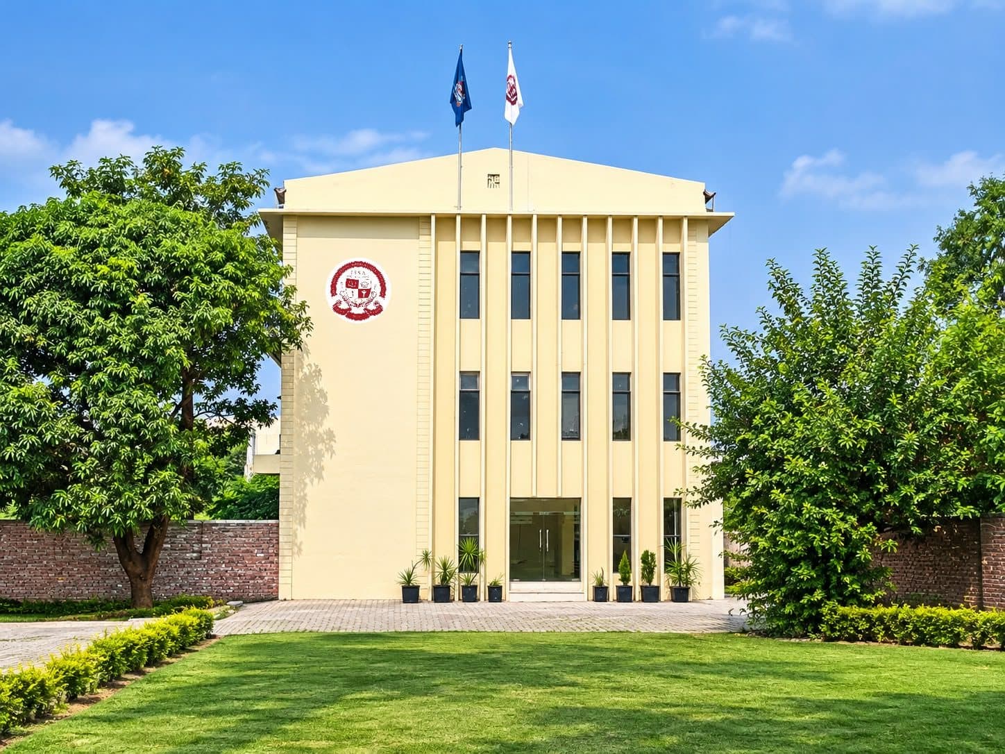 The ISSA academic block, a cream four-storey building with the ISSA crest