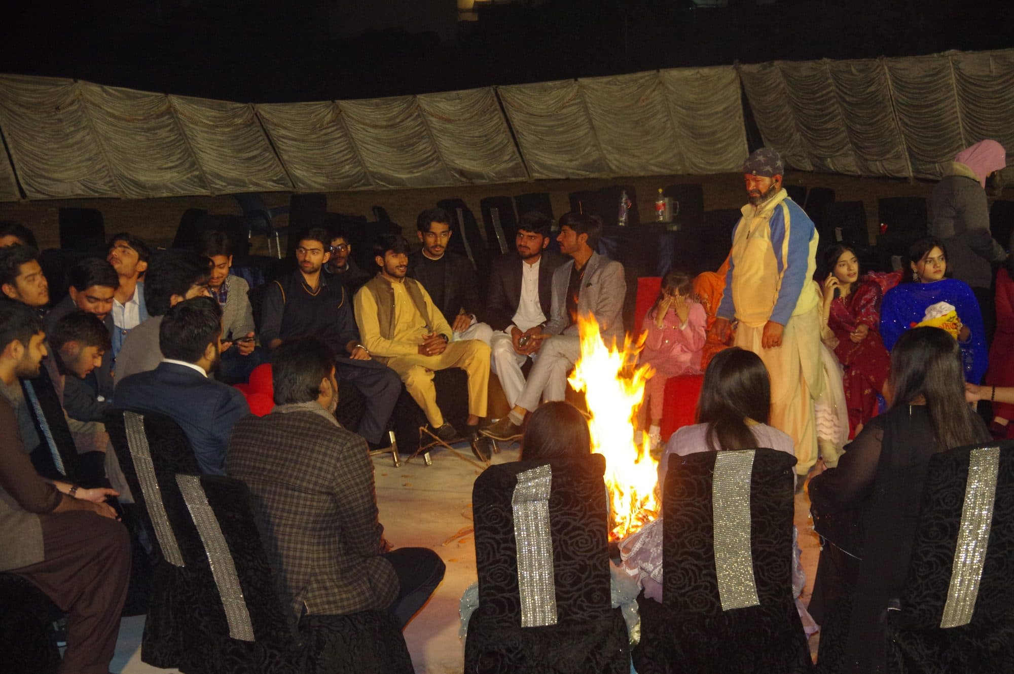 Students gathered around the bonfire after the Freshers' Party