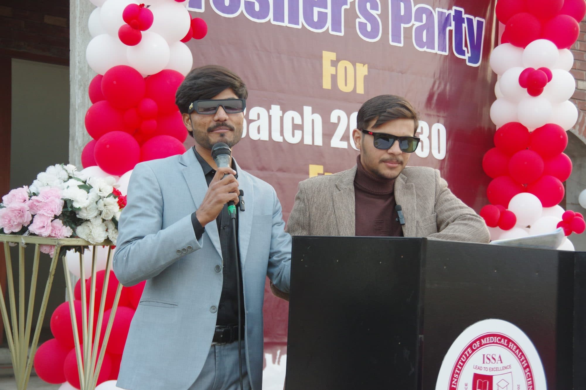 Student hosts at the lectern during the Freshers' Party