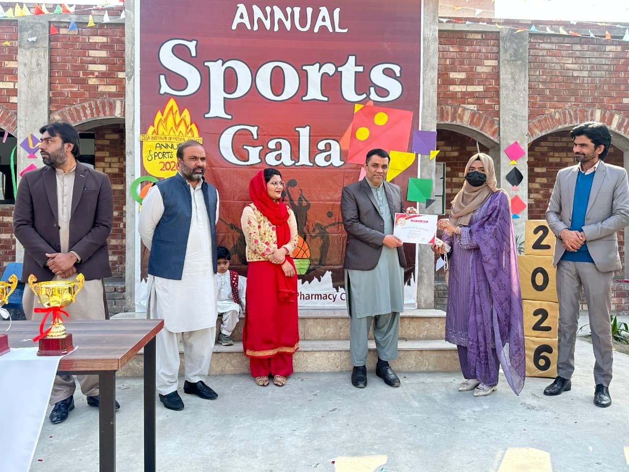 A student receiving a certificate at the Annual Sports Gala 2026
