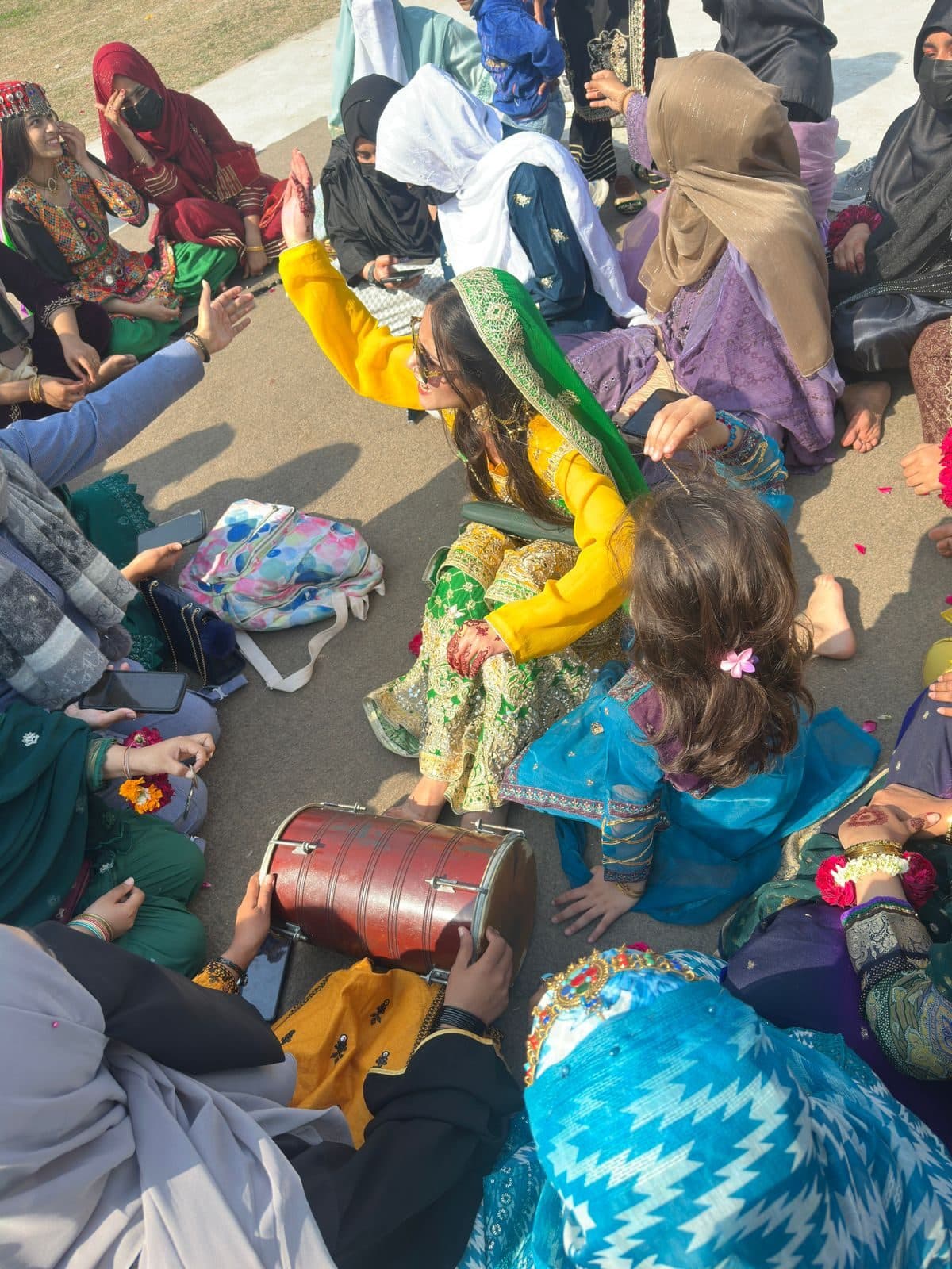 Students in traditional dress playing the dhol during the Sports Gala celebrations