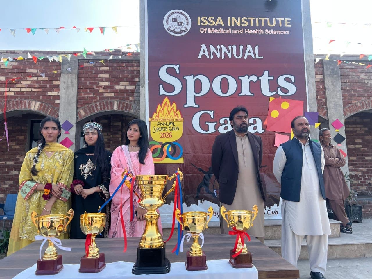 Faculty and students with the trophies at the Annual Sports Gala 2026