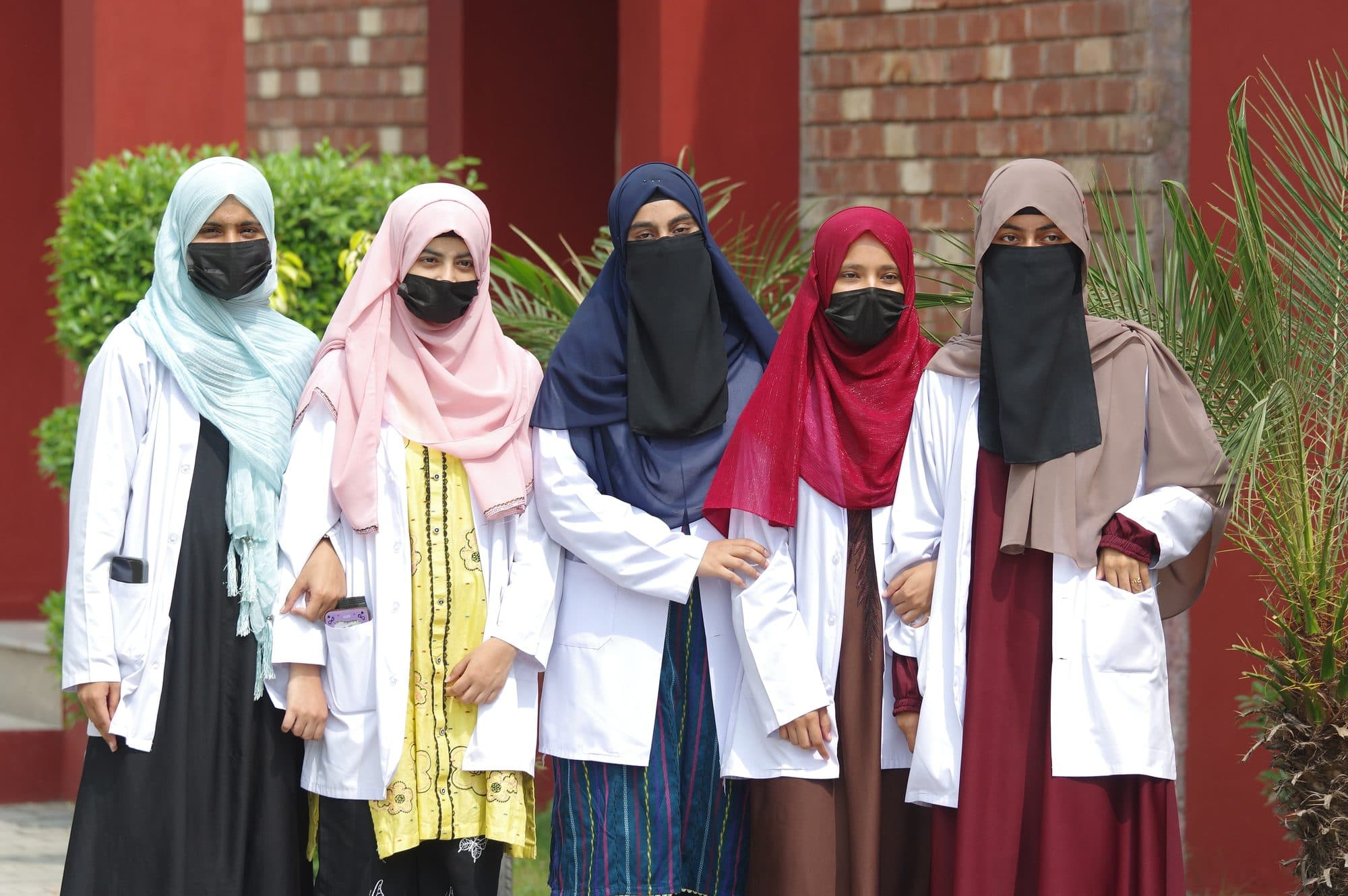 Pharmacy students in white coats on World Pharmacists Day