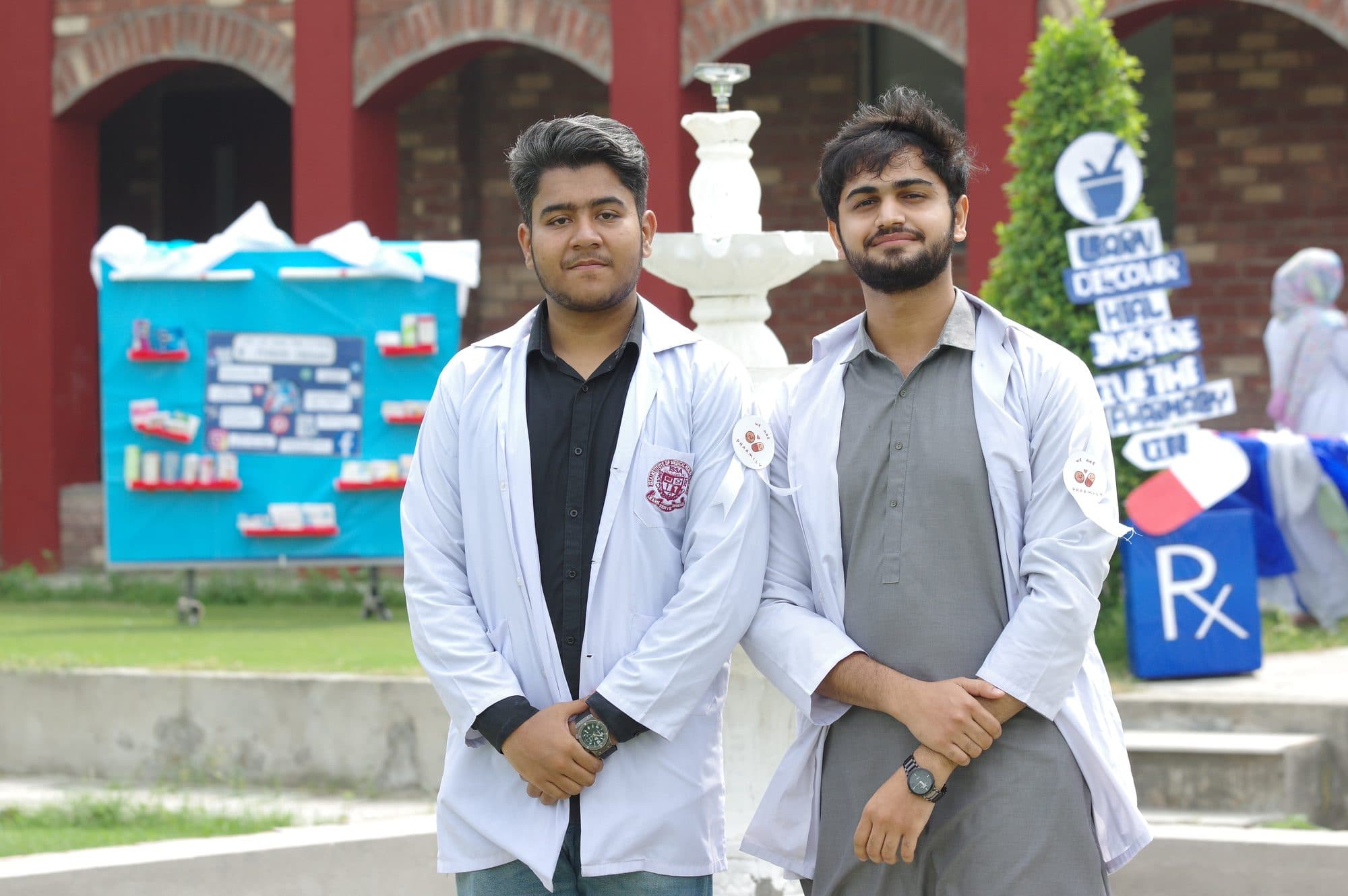 Two pharmacy students in white coats on World Pharmacists Day